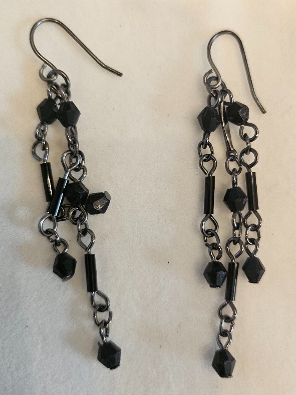 Dangly black beaded and silver plated earrings